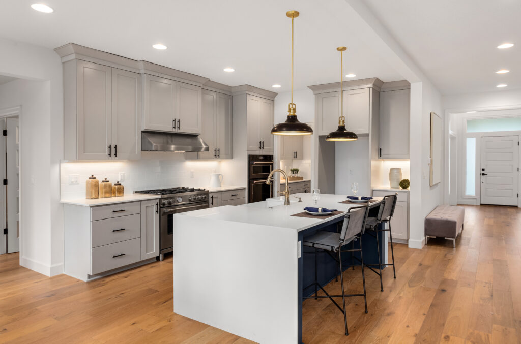 Kitchen,In,New,Luxury,Home,With,Waterfall,Island,,Stainless,Steel